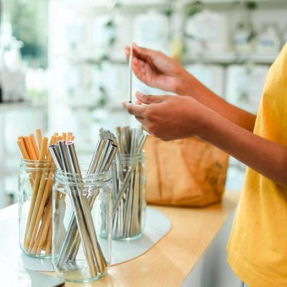 Zero waste shop. Girl buying in sustainable plastic free grocery store.Asian elder sale product in Zero Waste Shop.  .No plastic Conscious Minimalism Vegan Lifestyle Concept.